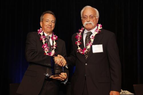 Robert Byrne, Ph.D. receives STEM Innovation & Research Award from Larry Langebrake of SRI (right).